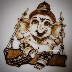 A close-up of the Ganesha portrait. I focus on the cheerful expression and small details like the jewelry and the pattern on his dhoti.