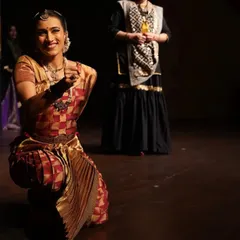 A kneeling pose from a performance, engaging directly with the audience. This image shows my ability to connect with viewers and draw them into the story being told on stage.