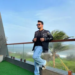 A casual but cool look with a varsity jacket and jeans, perfect for a relaxed party or a day out. My style is versatile and always on point.