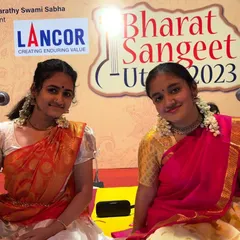 A happy moment on stage with my dear friend Sooryagayathri during our duet performance for Bharat Sangeet Utsav. The joy of singing together is clearly visible on our faces.