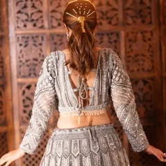 The delicate tie-up detail and pearl tassels on the back of this blouse add a touch of elegance. I focus on these small details to make your custom outfit feel special and unique.