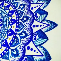 A close-up of the blue semi-mandala. You can see the different pen strokes, from solid fills to delicate lines and dots, which create a rich and varied texture.