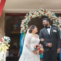 The joy on their faces says it all. A beautiful, candid shot of the couple walking out of the church, beaming with happiness after their wedding ceremony.