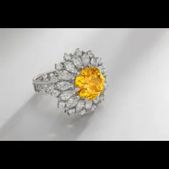 A floral-inspired statement ring featuring a vibrant round yellow gemstone at its center, encircled by marquise-cut diamonds. This image showcases my ability to balance complex designs and capture the unique character of colored gemstones for catalogue and campaign use.
