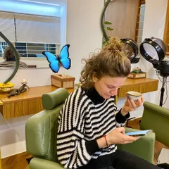 A client from France enjoying our iconic Ayurvedic detox tea before her Abhyanga full body massage. Her journey to us began with a search for authentic spiritual and wellness experiences in India.