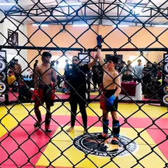 A view from outside the cage as one of our warriors is declared the winner. You can see the determination and spirit it takes to compete in youth MMA.