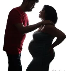 An intimate silhouette of a couple. This high-contrast technique creates a timeless and emotional portrait, focusing purely on their connection.