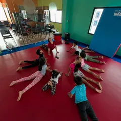 Our campers practice the cobra pose together, building back strength and flexibility while having fun as a group.