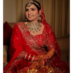 A happy, candid portrait of the bride. Her natural smile and the soft, warm lighting create a welcoming and beautiful image that captures her joy.