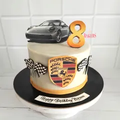 This stunning Porsche car-themed cake was for Nivaan’s 8th birthday. As a young car enthusiast, he was thrilled with this no-fondant cake featuring his favorite luxury car.