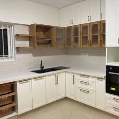 Minimal on the outside. Maximum storage where it counts. Like a good secret. This all-white kitchen features smart, seamless cabinetry and a built-in oven.