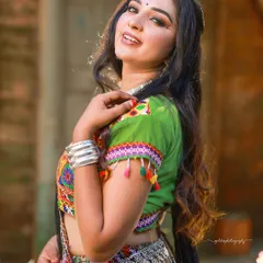 A beautiful portrait from the Navratri series, capturing the model's happy expression and the intricate details of her traditional Garba outfit.
