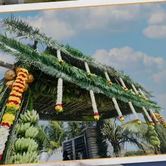 A traditional and eco-friendly entrance arch made entirely of woven coconut leaves, banana plants, and fresh flower garlands. This style is perfect for celebrating our rich Karnataka traditions.