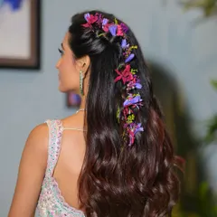 A detailed shot of the floral braid hairstyle. I work closely with hairstylists to ensure the entire look, from makeup to hair, is cohesive and tells a beautiful story.