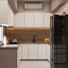 This U-shaped kitchen maximizes counter space and efficiency. The combination of white upper cabinets and a wood-textured backsplash creates a bright and warm environment.