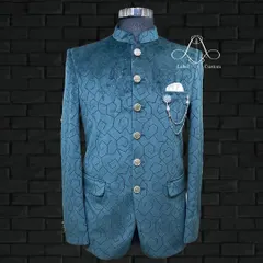 This is where fabric and design come together. A full view of my teal velvet bandhgala featuring a unique geometric pattern. It's a contemporary piece that feels both luxurious and distinctly stylish.