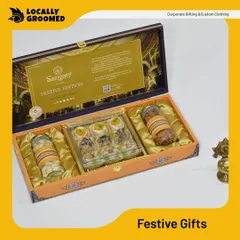A luxurious festive edition gift box from Sangam. This hamper includes traditional Indian sweets and premium nuts, presented in an ornate box perfect for high-end client gifting during festival seasons.