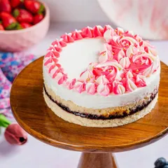 Our Pink Paradise cake is a true showstopper. With layers of vanilla sponge, cream cheese, and oozing berries, it's a melt-in-your-mouth experience decorated with beautiful pink and white frosting.