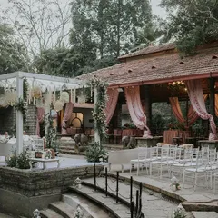 The Tamarind Tree in Bangalore is a stunning heritage venue that provides a naturally beautiful backdrop. This wide shot shows how our pastel and floral decor complemented the venue's rustic charm for Ridhi and Prashanth's wedding.