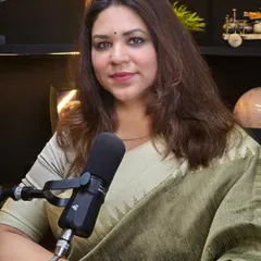 A professional headshot taken during a podcast recording. I use these platforms to address tough questions and share my perspective on legal issues, turning criticism into fuel for my mission to build a more just society.