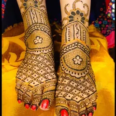 An elegant and symmetrical foot design, featuring delicate floral motifs and fine line work that beautifully adorns the feet.