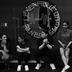 Strength feels different when it is shared. This is a candid moment of our community relaxing and connecting after a workout. This is the support system that makes us stronger.