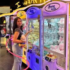 I want them all. The claw machine struggle is real, but at least we got one cute prize. The doodles capture the arcade excitement.