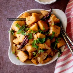 Our Masala Idli Fry is a delicious and savory breakfast option. We take soft, steamed idlis, cut them into cubes, and sauté them with onions, mustard seeds, and aromatic spices for a flavorful twist.