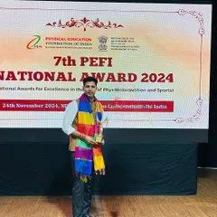 Receiving the 'Best Coach Award' at the 7th PEFI National Awards. It was an honor to be recognized among so many esteemed leaders in Indian sports.