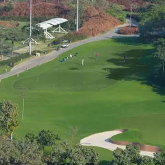 An aerial view of our pristine practice facilities, including the driving range and putting greens. We provide the perfect environment to learn, practice, and perfect every aspect of your game.