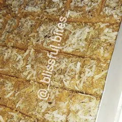 A tray of my homemade Gur Paapdi, a traditional sweet made from jaggery and wheat flour. This melt-in-your-mouth delicacy will take you back to your childhood.