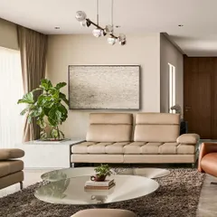 This living room was designed to be versatile, perfect for hosting business meetings or a gathering of close friends. The arrangement of the leather sofas and recliner creates a comfortable and conversational setting.