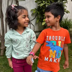 A shared smile and a handmade band. These are the simple, joyful moments that build the foundation of lifelong friendships at Kriya.