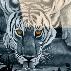 A powerful perspective of the tiger mural, showing it leaning down to drink. The realism and detail make it feel as if the tiger is right there in the room.