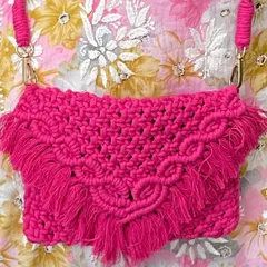 I just love this hot pink sling bag! The color is so vibrant and happy. It has a beautiful V-flap design with fringes and a sturdy braided strap, making it a perfect statement piece for any outfit.