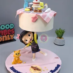 This baking-themed anti-gravity cake was a joy to create. A little baker figurine holds up a floating tier filled with miniature baking tools, all handcrafted from fondant.