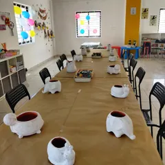 All set for an animal-themed party! The tables are ready with blank animal planters, just waiting for the kids to add their creative touch.