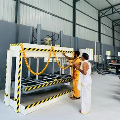 Inaugurating the hydraulic hot press machine at our factory. This machine is crucial for laminating panels evenly, guaranteeing a bubble-free and long-lasting finish.