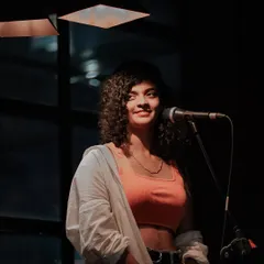A smile for the audience at Nosh Haus in Kochi. In these smaller settings, I can really connect with everyone and share stories between songs.