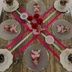 This pink ribbon-themed tablescape was designed to celebrate with grace and purpose. The bold geometric lines of the ribbons contrast with soft florals, creating a modern and elegant look perfect for a special brunch or awareness event.