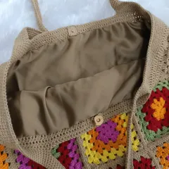 A look inside the tote reveals the smooth, buttery soft lining and a simple wooden button closure I added to help keep your belongings secure.
