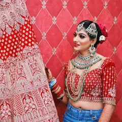 This is a fun, contemporary take on the getting-ready shot. By pairing the traditional bridal blouse and jewellery with casual jeans, we capture the bride's personality and the exciting transition on her big day.