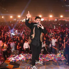 The incredible Mika Singh commands the stage, engaging with a massive, energetic crowd during the New Year's Eve concert. Our artist management and stage production services ensure a seamless and powerful performance every time.