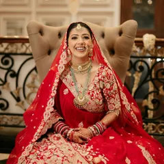 That priceless smile of a happy bride is what I live for. For Sona, we went with a classic red lehenga look, focusing on radiant skin and eyes that sparkle, making her look absolutely breathtaking in her wedding photos.