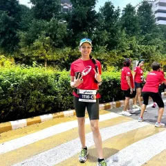 A participant looking happy and confident during the ASICS Gel Kayano 31 launch run. We help our runners achieve their personal bests.