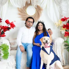 A complete family portrait with the furry member included. This shot captures the joy of the expecting couple and their happy dog in our boho studio.