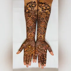 A slightly different angle of the peacock and gulf flower design, showing how the patterns wrap around the arms for a complete and symmetrical look.