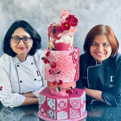 Posing with my mentor, Chef Deepali Sawant, and our collaborative Moroccan-themed wedding cake, featuring intricate tile work and handmade sugar flowers.