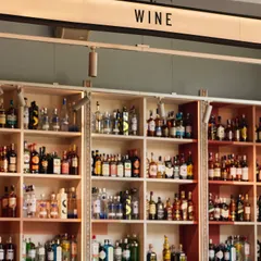Our bar is organized to showcase our extensive collection, including a dedicated section for wines. We pride ourselves on offering a diverse range of options to suit every palate.