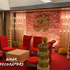 Another view of the 'Din Shagna Da' mandap, showing the traditional floral-wrapped pillars and seating arrangement. This design is perfect for creating a classic and auspicious setting within a banquet hall.